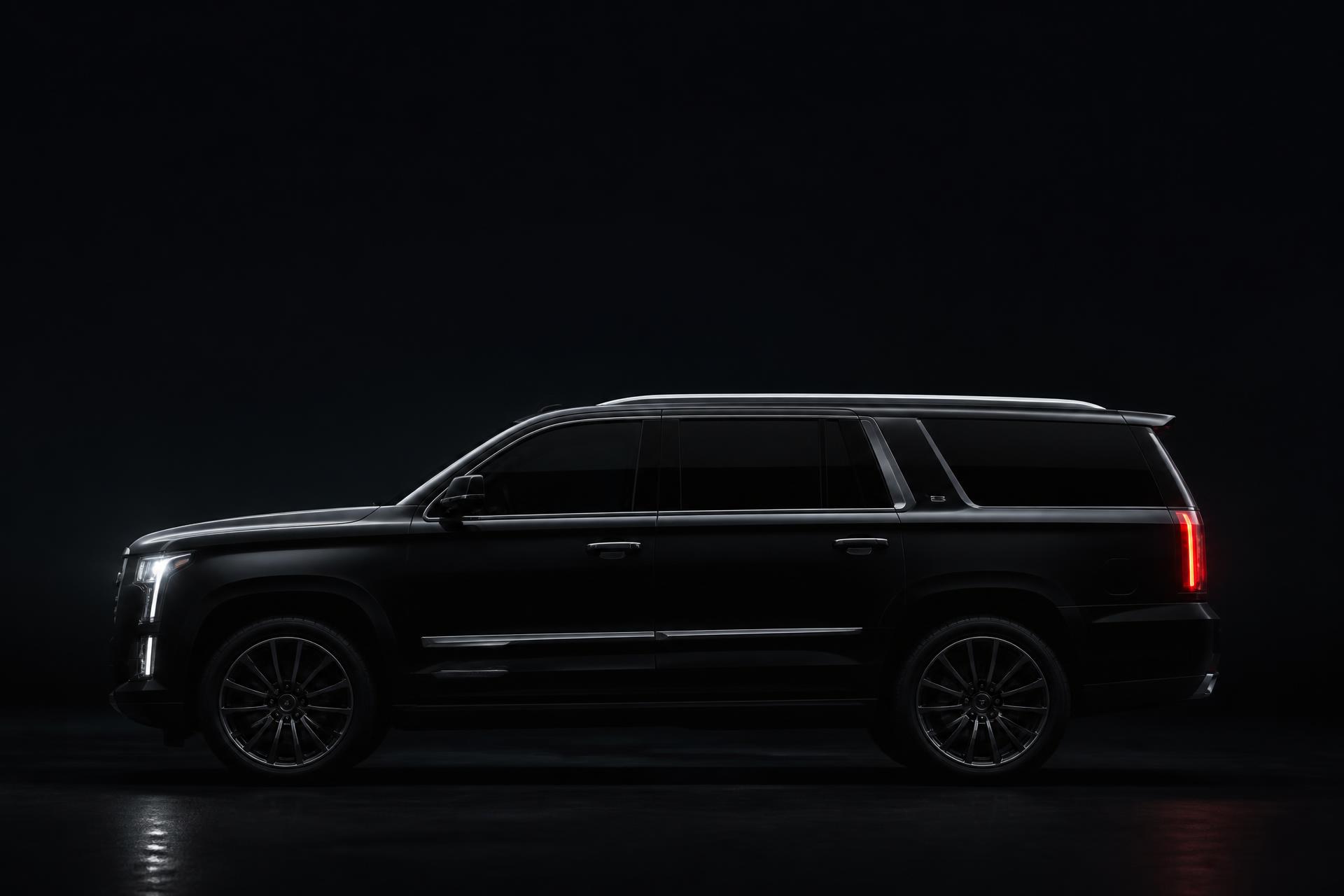 BlackX night pickup Black luxury SUV with chauffeur waiting outside a San Antonio hotel at night