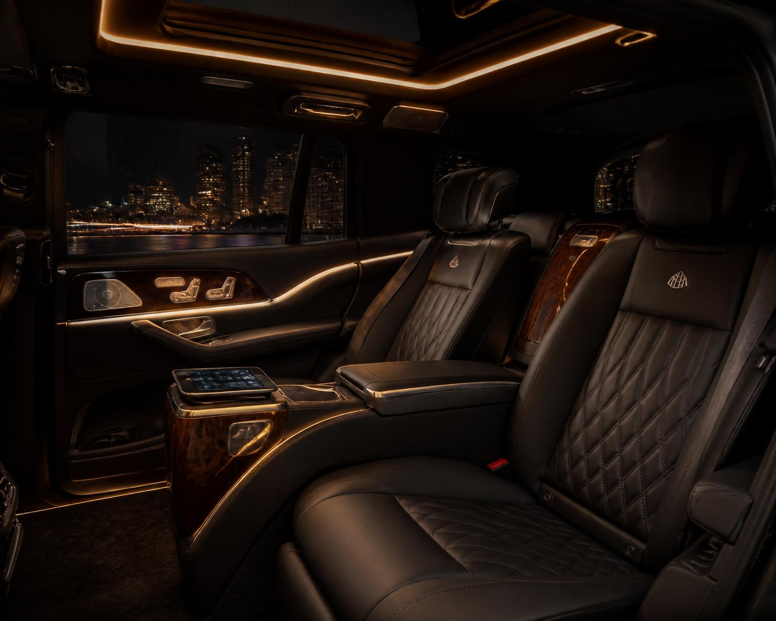 Interior cabin of a BlackX VIP SUV with ambient lighting and quiet, executive seating